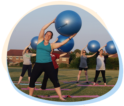 outdoor fitness class with gym balls