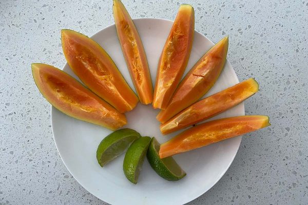 papaya and lime on a plate